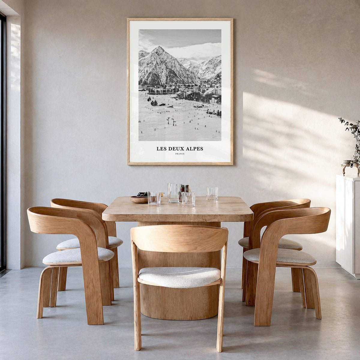 Les Deux Alpes Classic Poster in a natural wood frame, hanging in a dining room