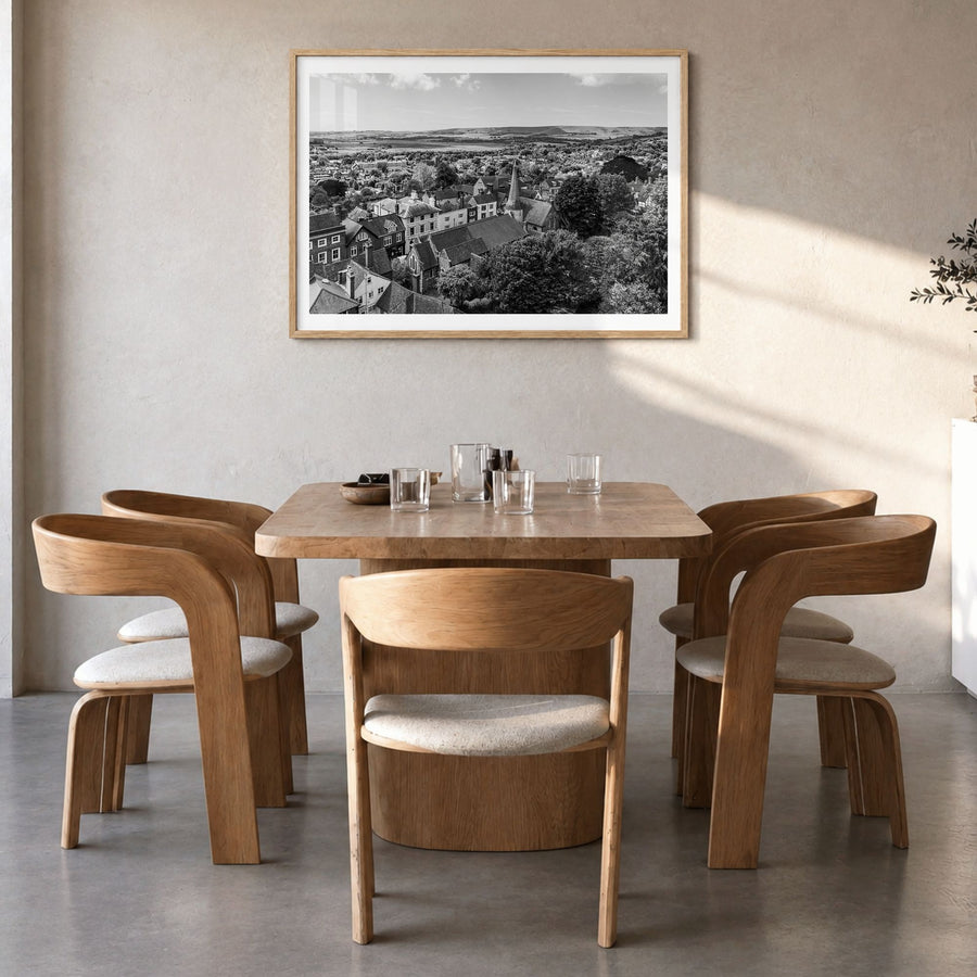 Lewes Photo Poster in a natural wood frame, hanging in a dining room, white border