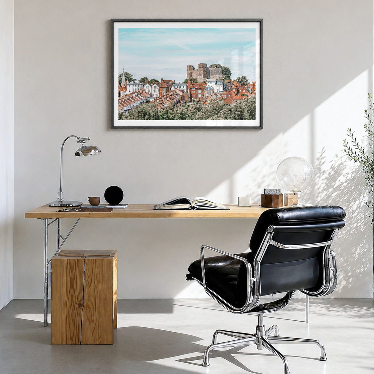 Lewes Photo Poster in a black wood frame, hanging in a bright home office, white border