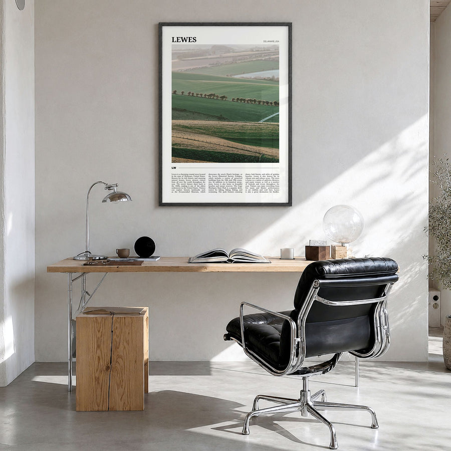 Lewes Travel Poster in a black wood frame, hanging in a bright home office