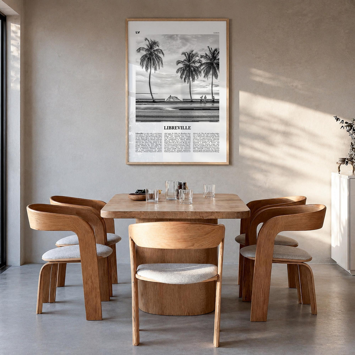 Libreville black & white newspaper poster of Gabon – vertical wall art in natural wood frame, hanging on wall
