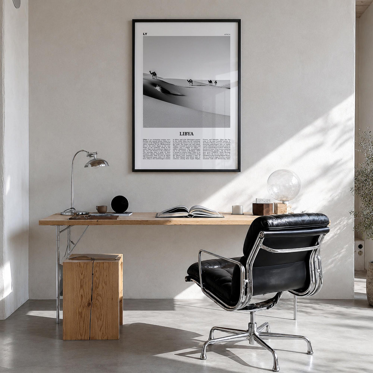 Libya black & white newspaper poster of Africa – vertical wall art in black wood frame, hanging on wall