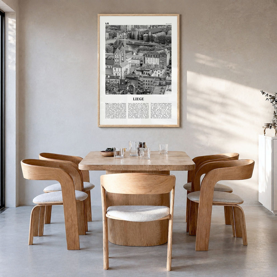 Liège Newspaper Poster in a natural wood frame, hanging in a dining room