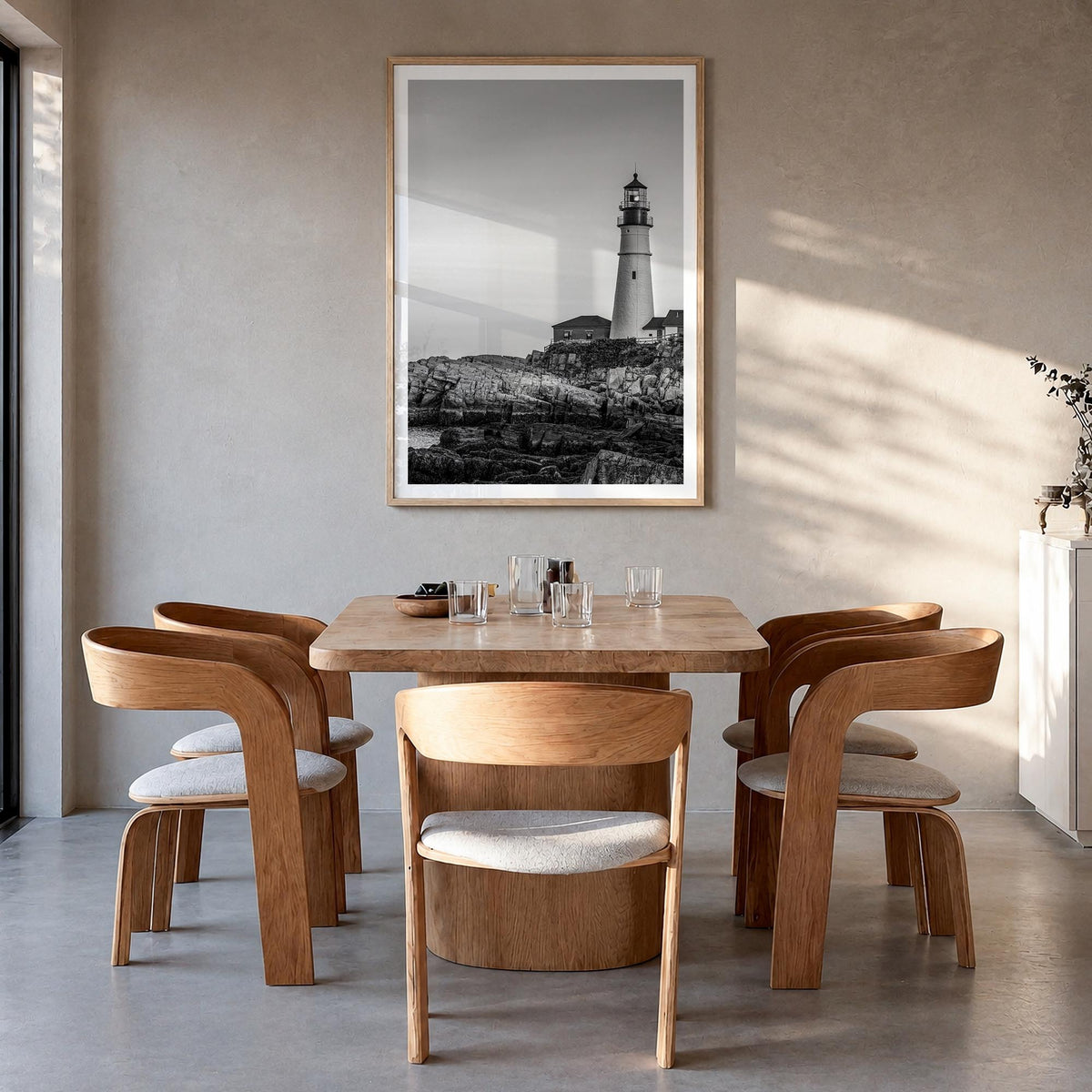 Lighthouse no. 1 black & white photo poster – vertical wall art in natural wood frame with white border, hanging on wall