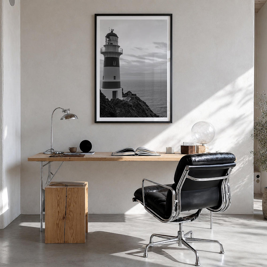 Lighthouse no. 2 black & white photo poster – vertical wall art in black wood frame with white border, hanging on wall