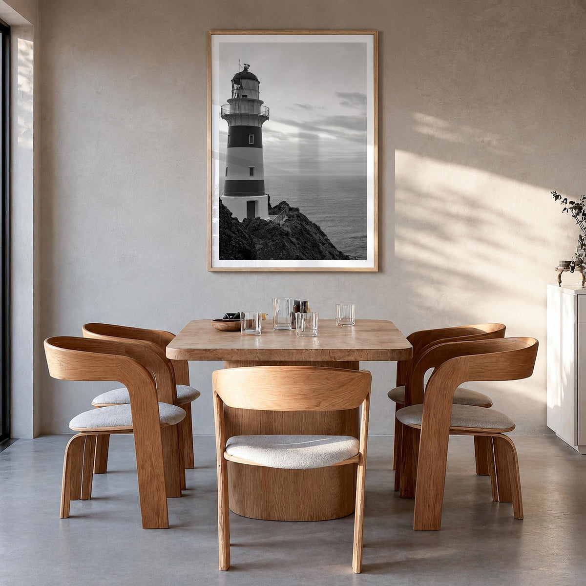 Lighthouse no. 2 black & white photo poster – vertical wall art in natural wood frame with white border, hanging on wall