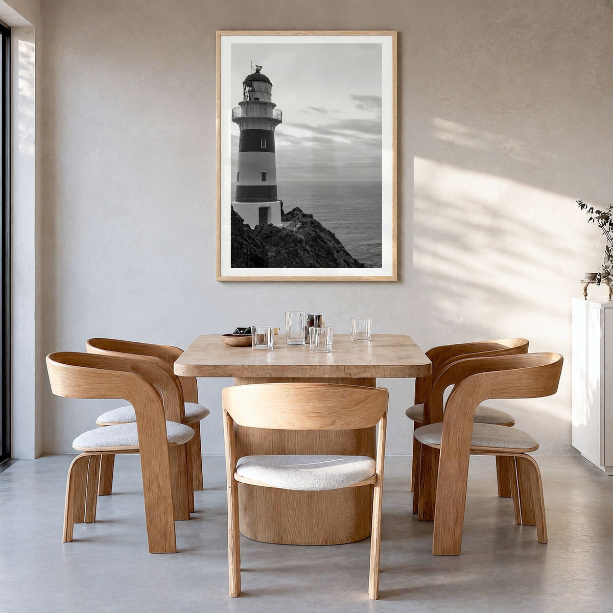 Lighthouse Photo No 2 Poster in a natural wood frame, hanging in a dining room, white border