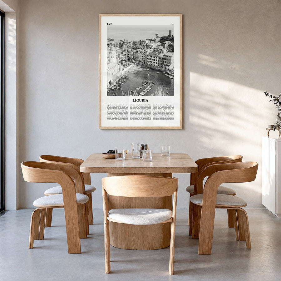Liguria Newspaper Poster in a natural wood frame, hanging in a dining room