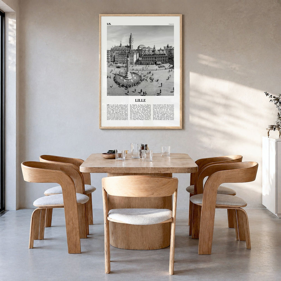 Lille Newspaper Poster in a natural wood frame, hanging in a dining room