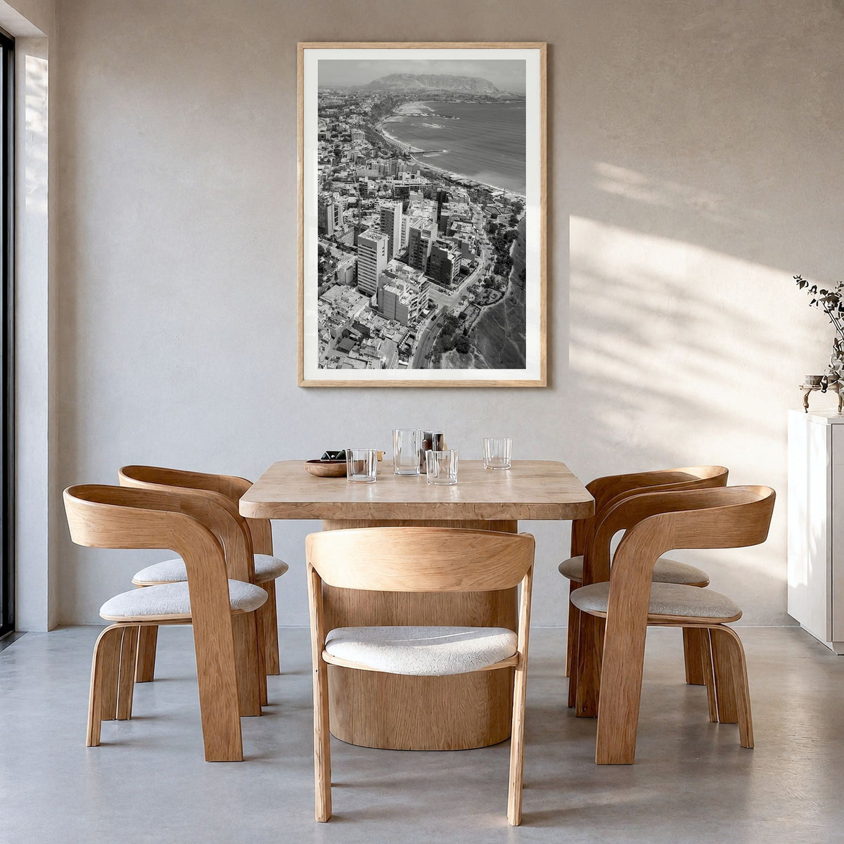 Lima Photo Poster in a natural wood frame, hanging in a dining room, white border