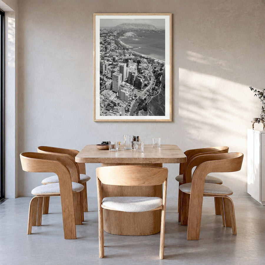 Lima Photo Poster in a natural wood frame, hanging in a dining room, white border