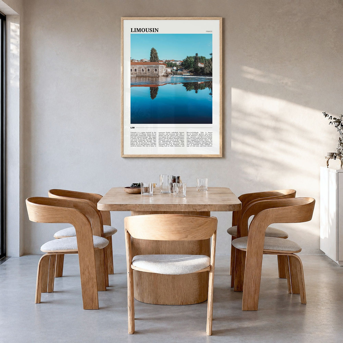 Limousin Travel Poster in a natural wood frame, hanging in a dining room