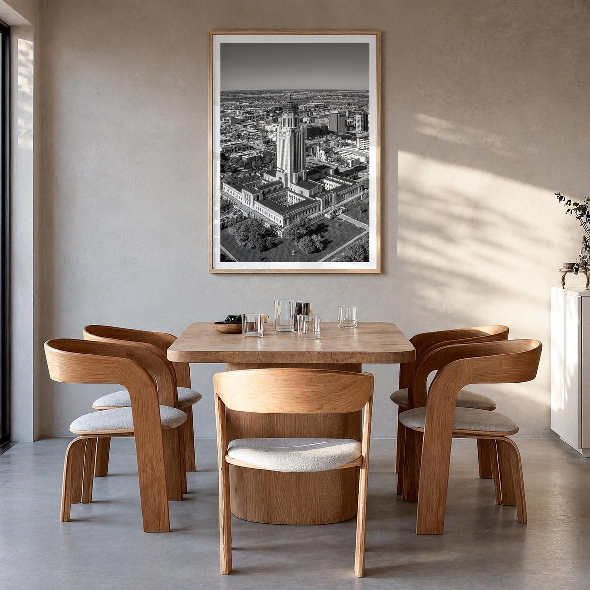Lincoln black & white photo poster of Nebraska, USA – vertical wall art in natural wood frame with white border, hanging on w