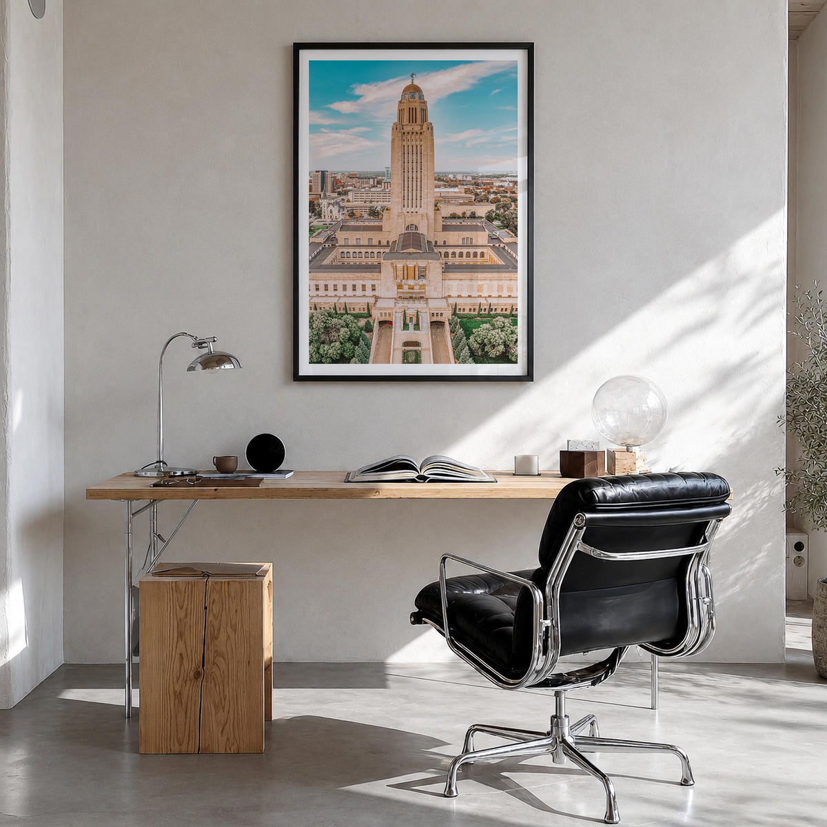 Lincoln colorful photo poster of Nebraska, USA – vertical wall art in black wood frame with white border, hanging on wall