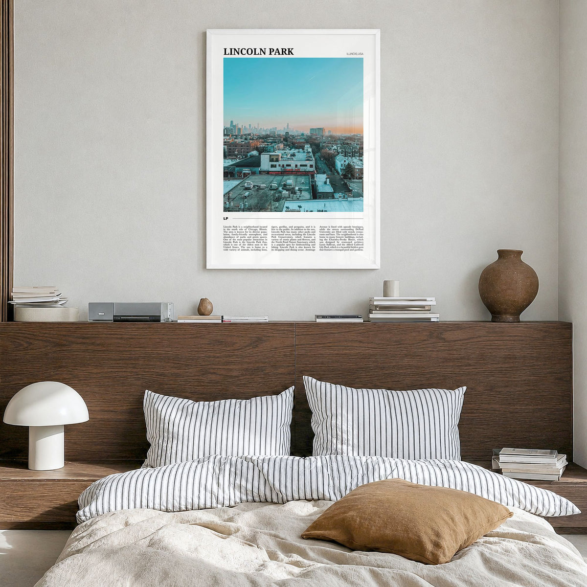 Lincoln Park Travel Poster in a white wood frame, hanging in a bedroom