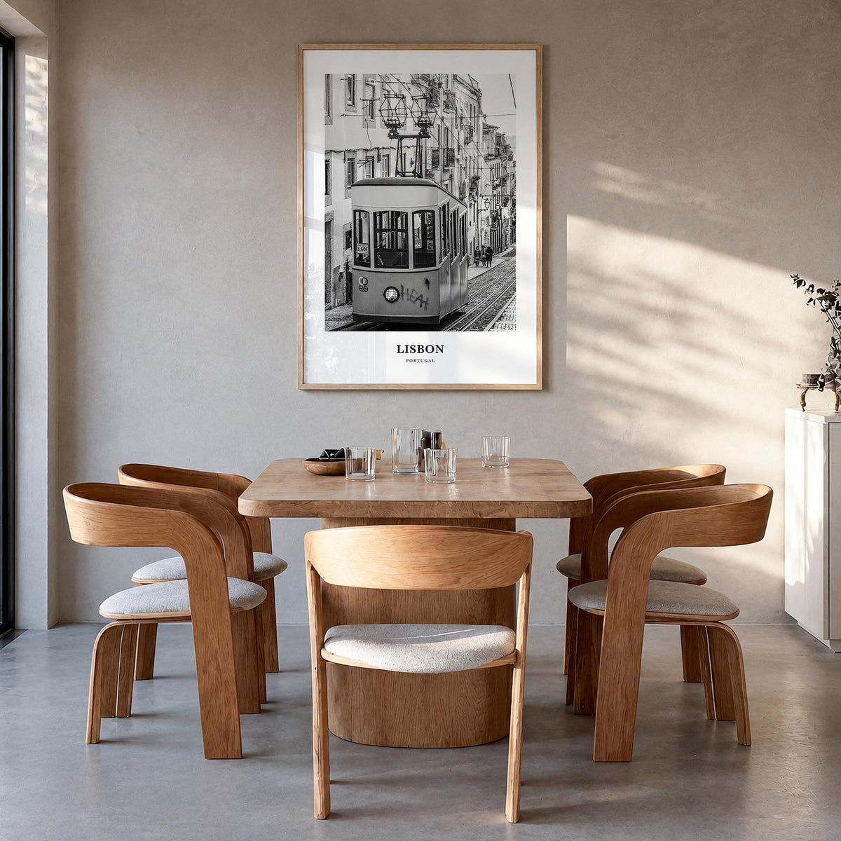 Lisbon no. 1 black & white classic poster of Portugal – vertical wall art in natural wood frame, hanging on wall