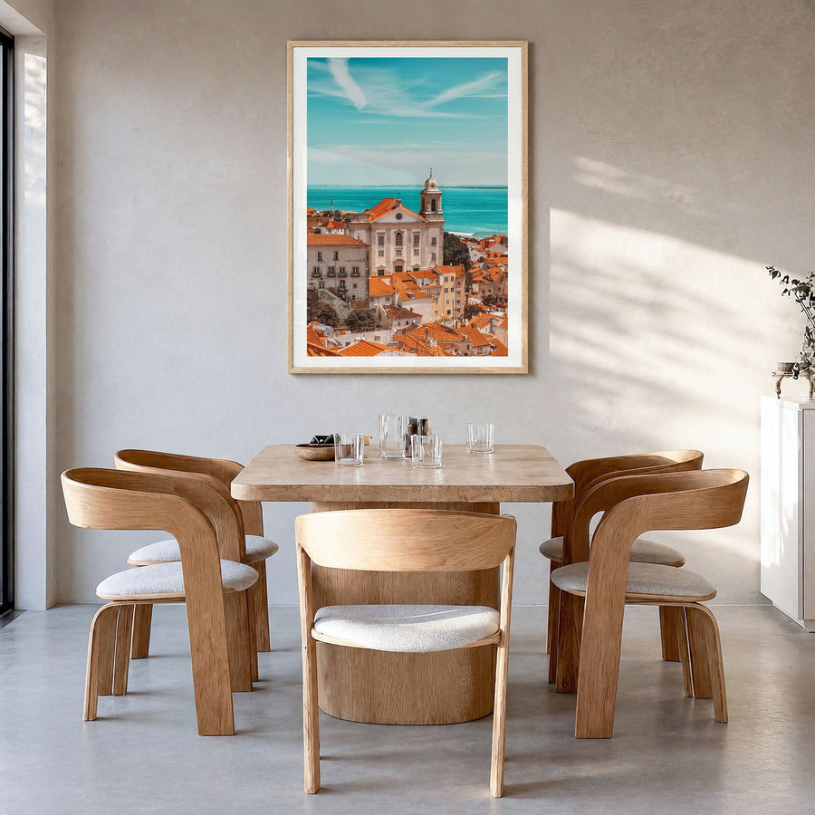 Lisbon Photo No 1 Poster in a natural wood frame, hanging in a dining room, white border
