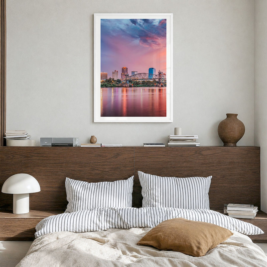 Little Rock Photo Poster in a white wood frame, hanging in a bedroom, white border