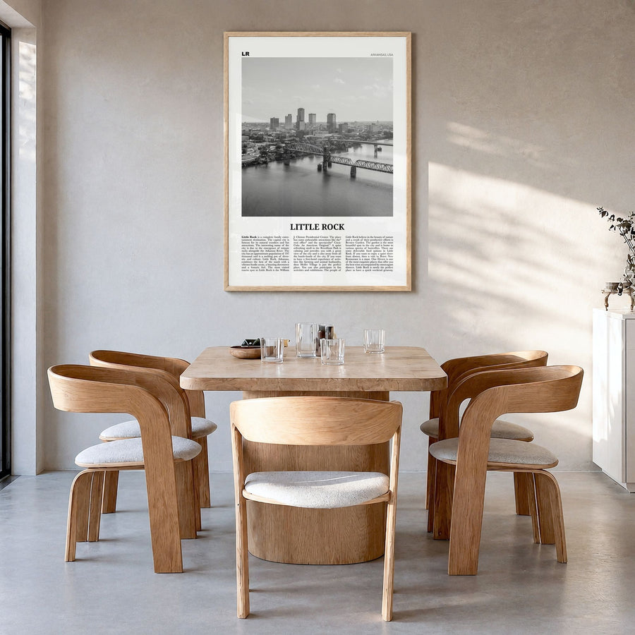 Little Rock Newspaper Poster in a natural wood frame, hanging in a dining room