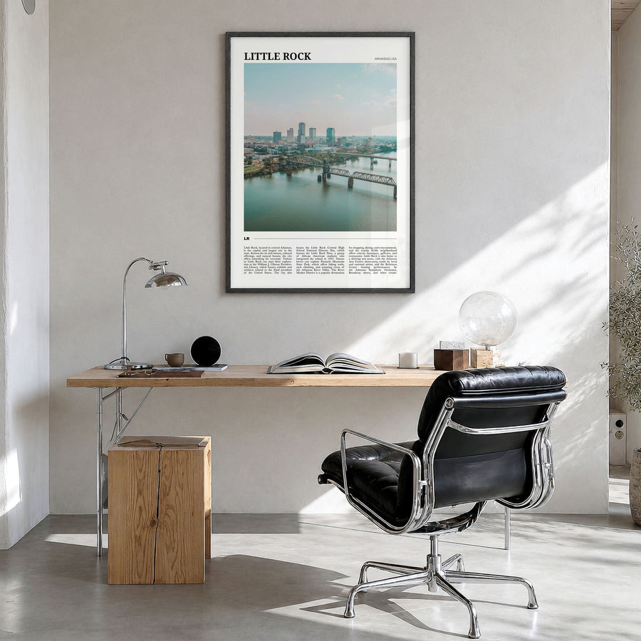 Little Rock Travel Poster in a black wood frame, hanging in a bright home office