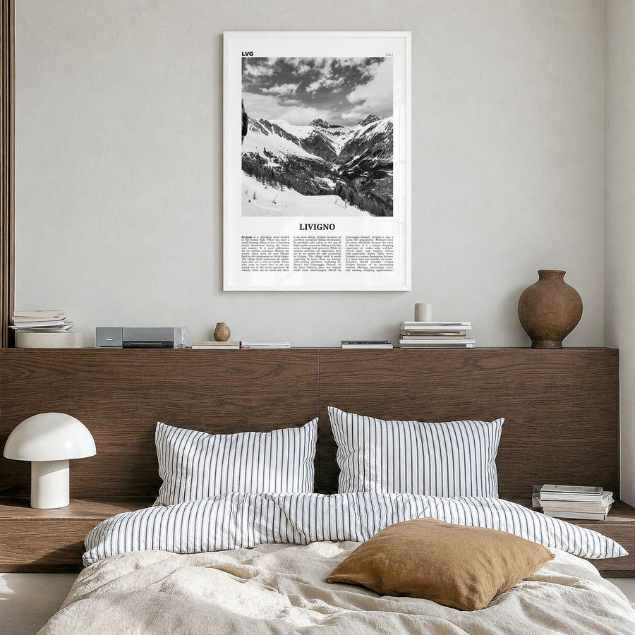 Livigno Newspaper Poster in a white wood frame, hanging in a bedroom