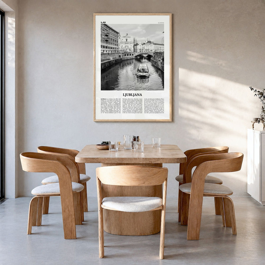 Ljubljana Newspaper Poster in a natural wood frame, hanging in a dining room