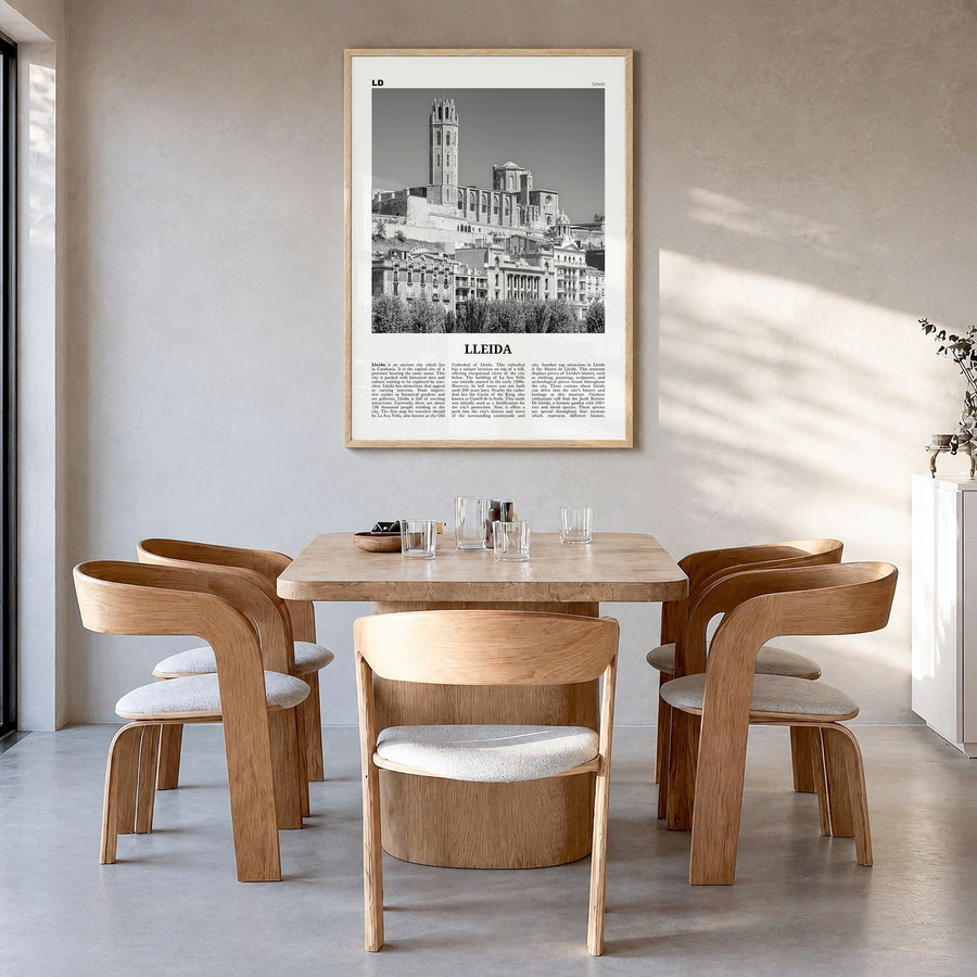 Lleida Newspaper Poster in a natural wood frame, hanging in a dining room