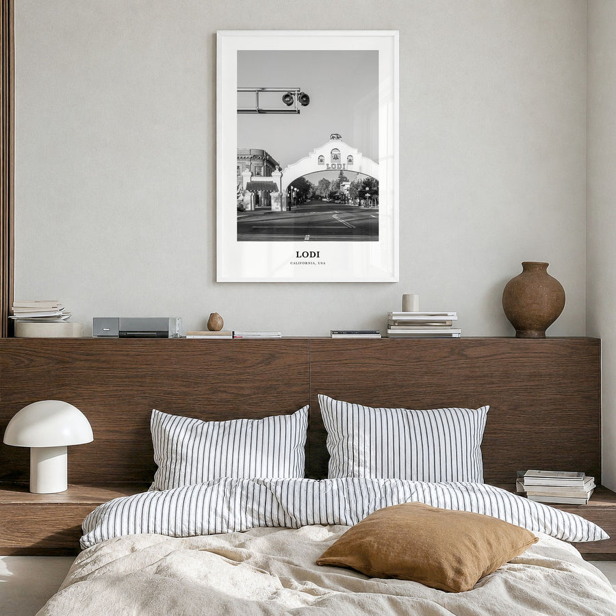 Lodi Classic Poster in a white wood frame, hanging in a bedroom