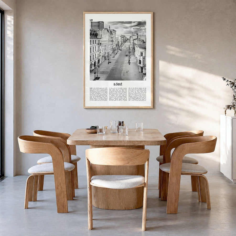 Łódź Newspaper Poster in a natural wood frame, hanging in a dining room