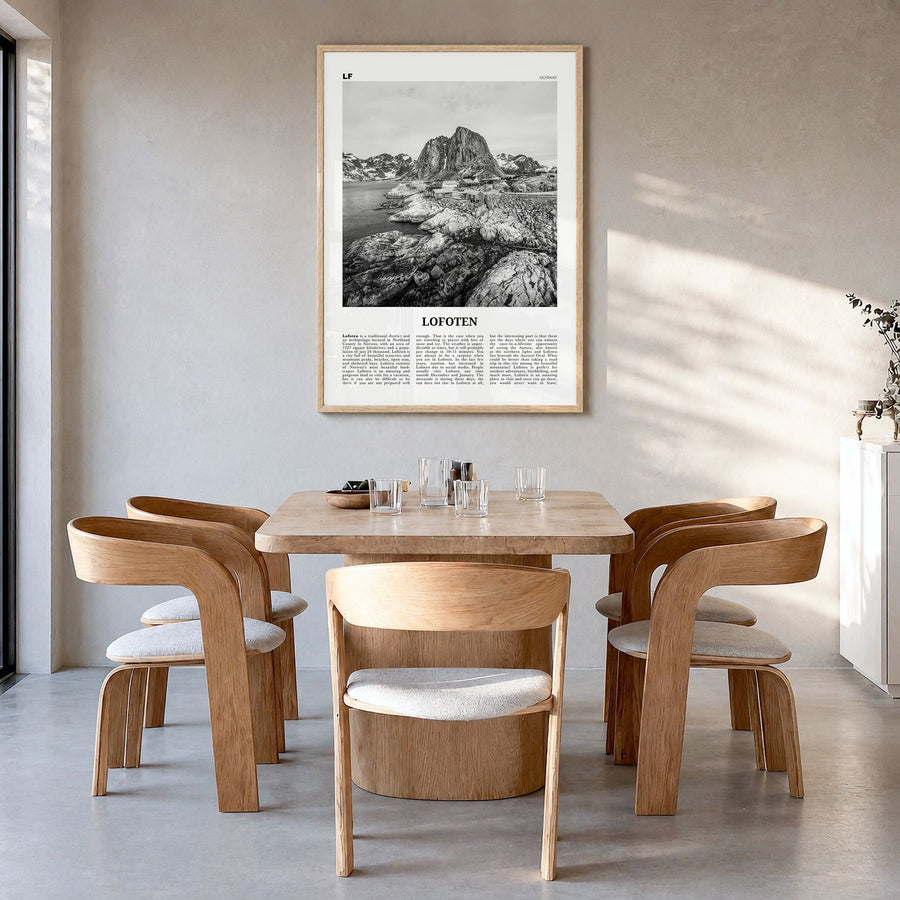 Lofoten Newspaper Poster in a natural wood frame, hanging in a dining room