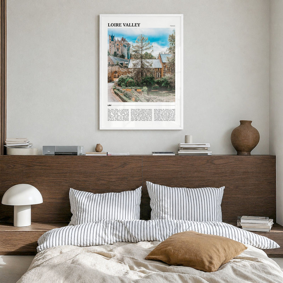 Loire Valley Travel Poster in a white wood frame, hanging in a bedroom