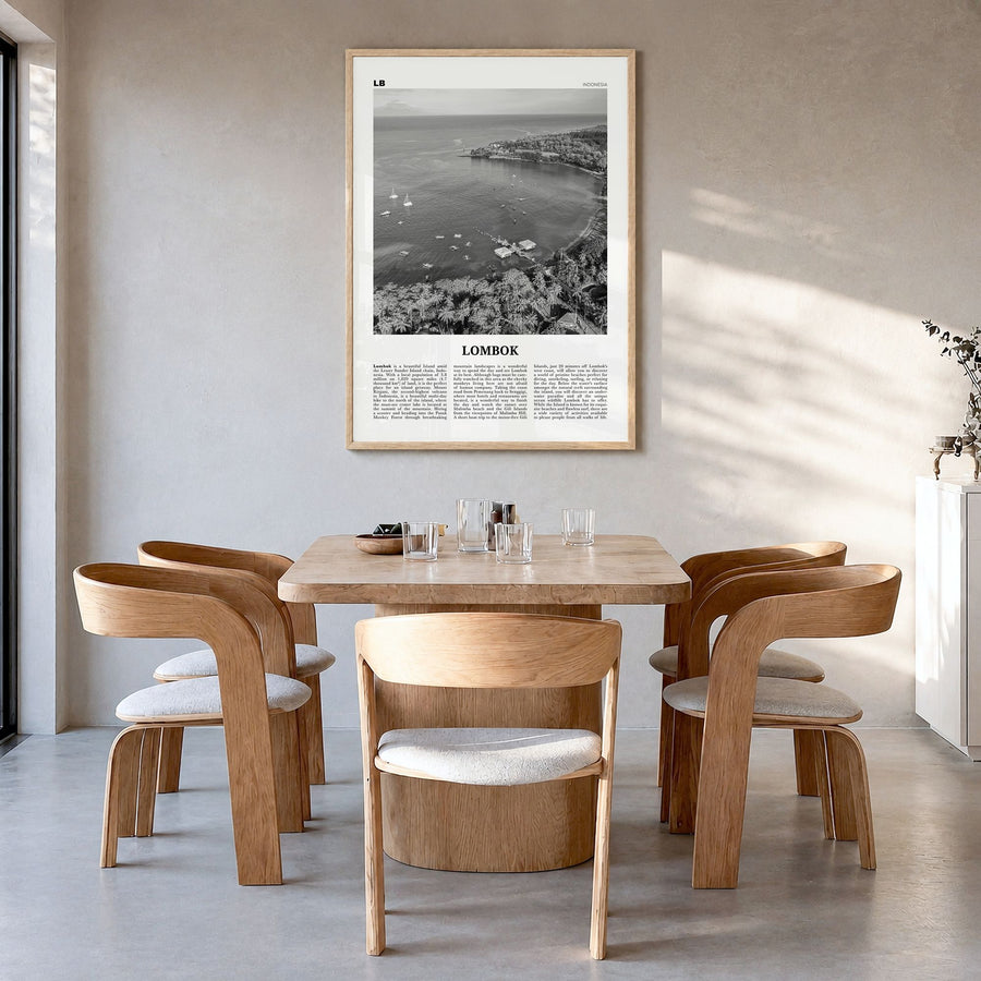 Lombok Newspaper Poster in a natural wood frame, hanging in a dining room