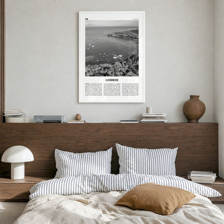 Lombok Newspaper Poster in a white wood frame, hanging in a bedroom
