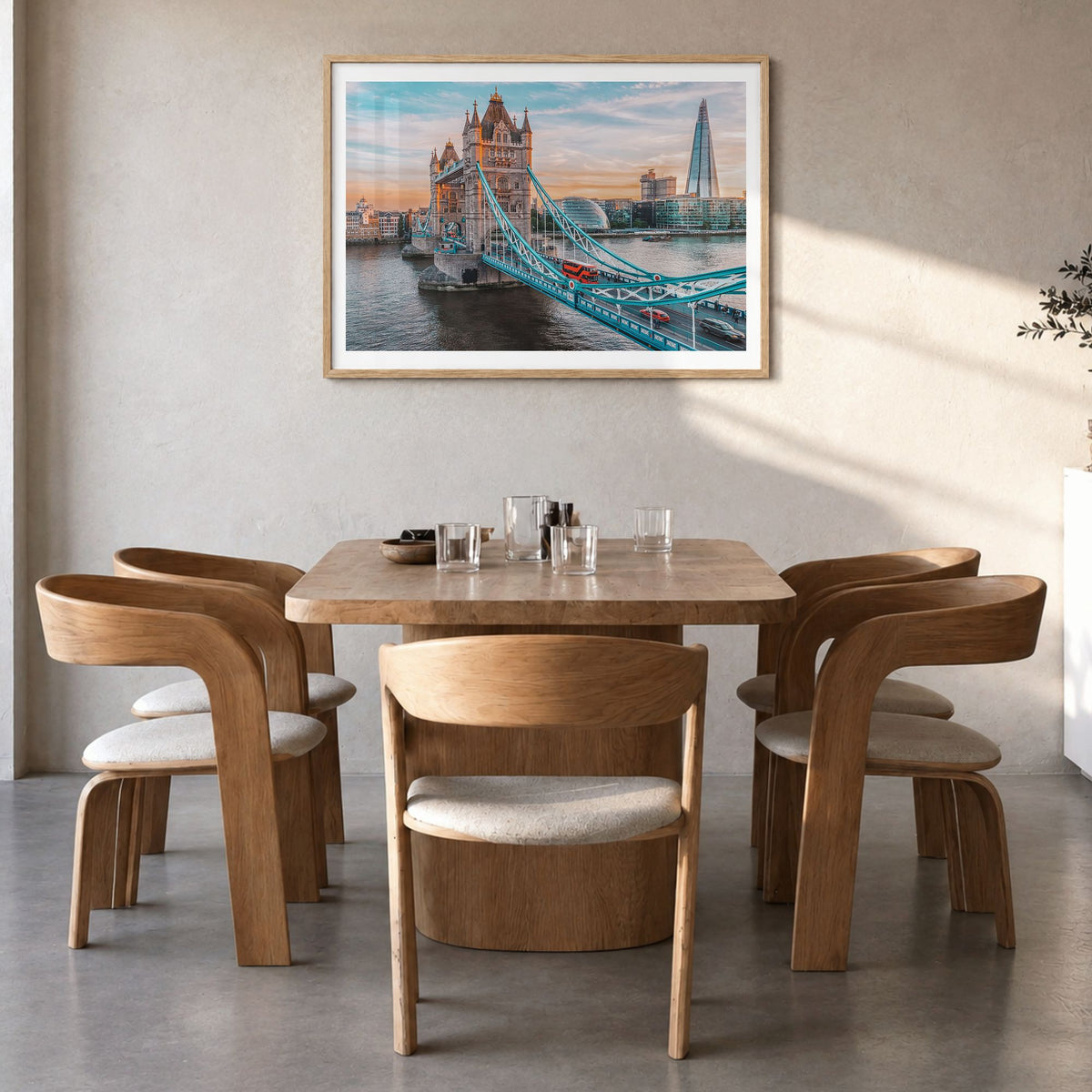 London Photo Poster in a natural wood frame, hanging in a dining room, white border