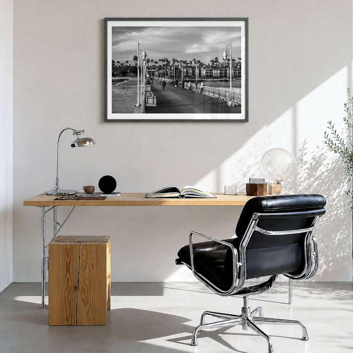 Long Beach Photo Poster in a black wood frame, hanging in a bright home office, white border