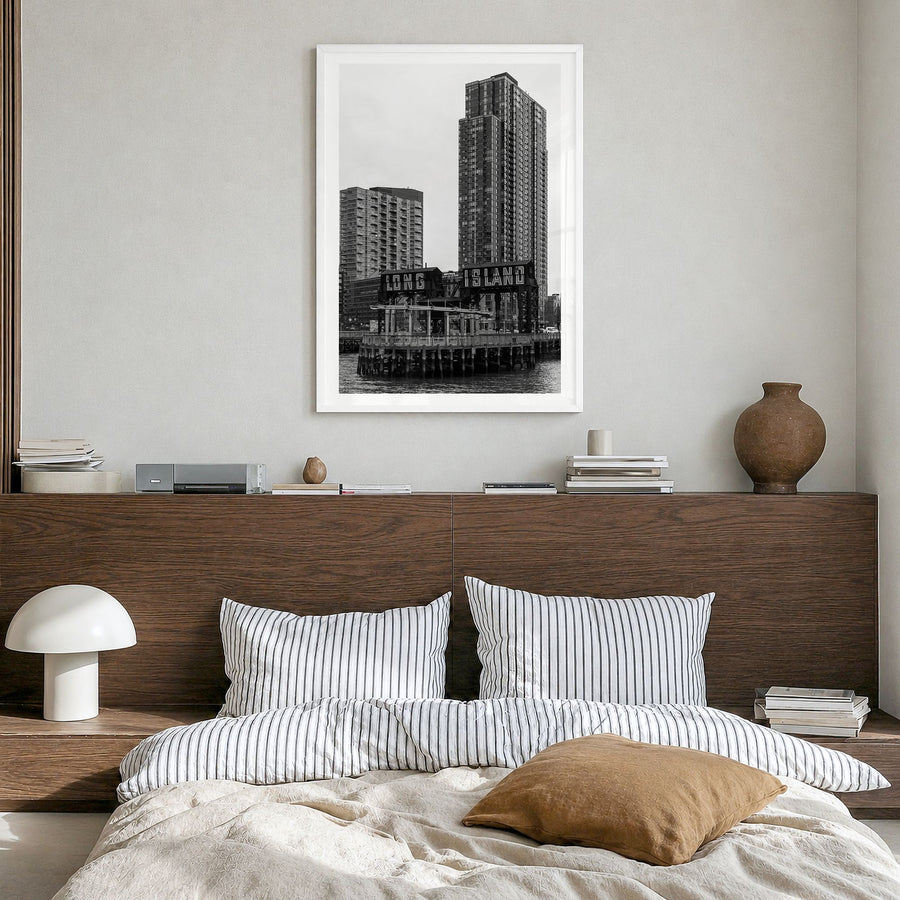 Long Island City Photo Poster in a white wood frame, hanging in a bedroom, white border