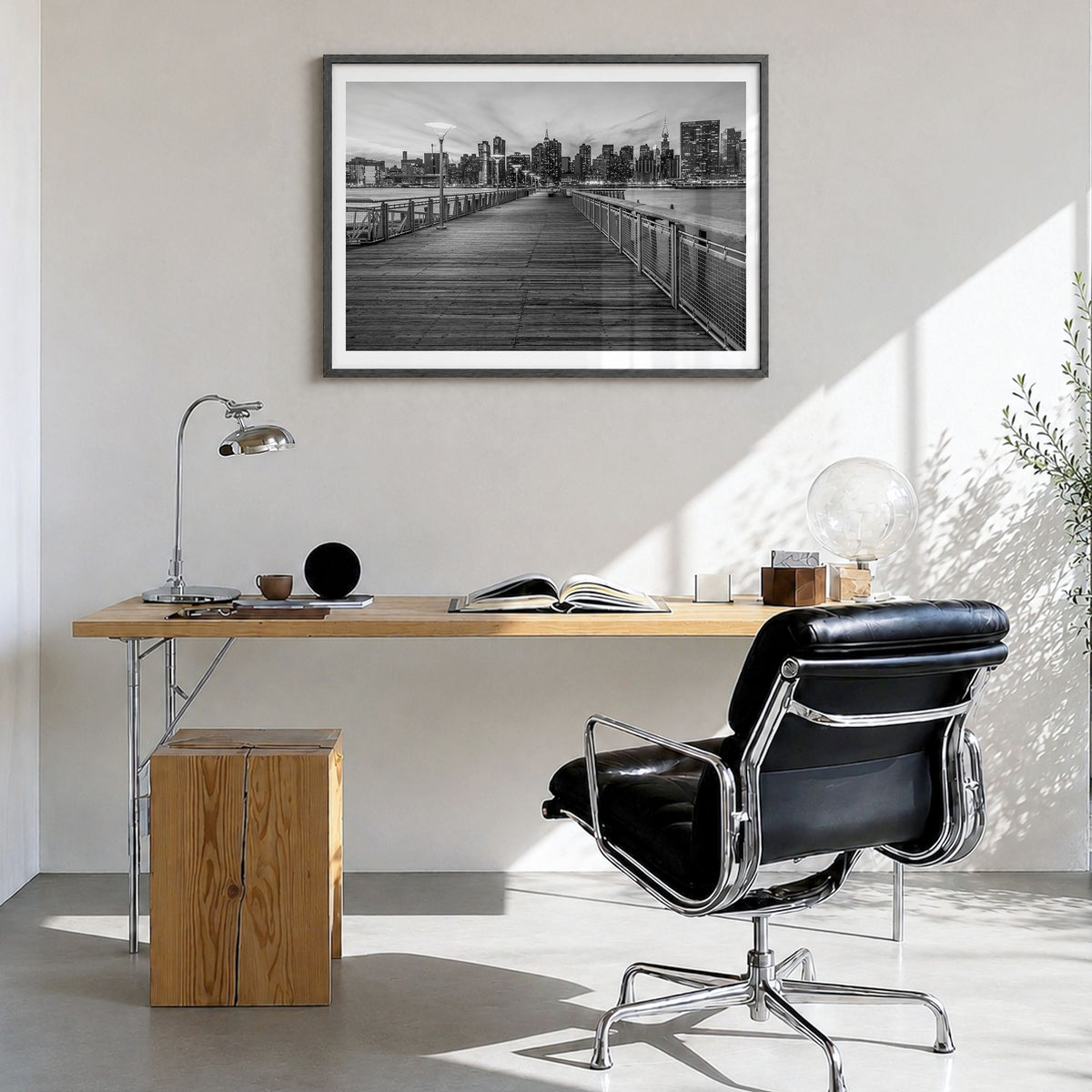 Long Island Photo Poster in a black wood frame, hanging in a bright home office, white border