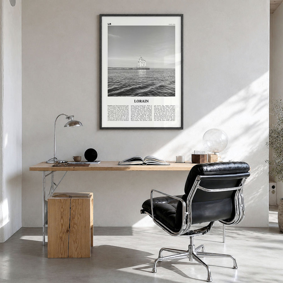 Lorain Newspaper Poster in a black wood frame, hanging in a bright home office