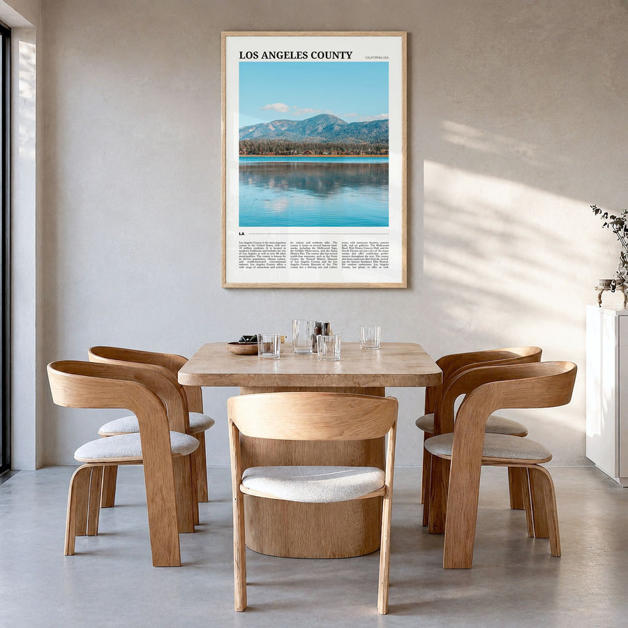 Los Angeles County Travel Poster in a natural wood frame, hanging in a dining room