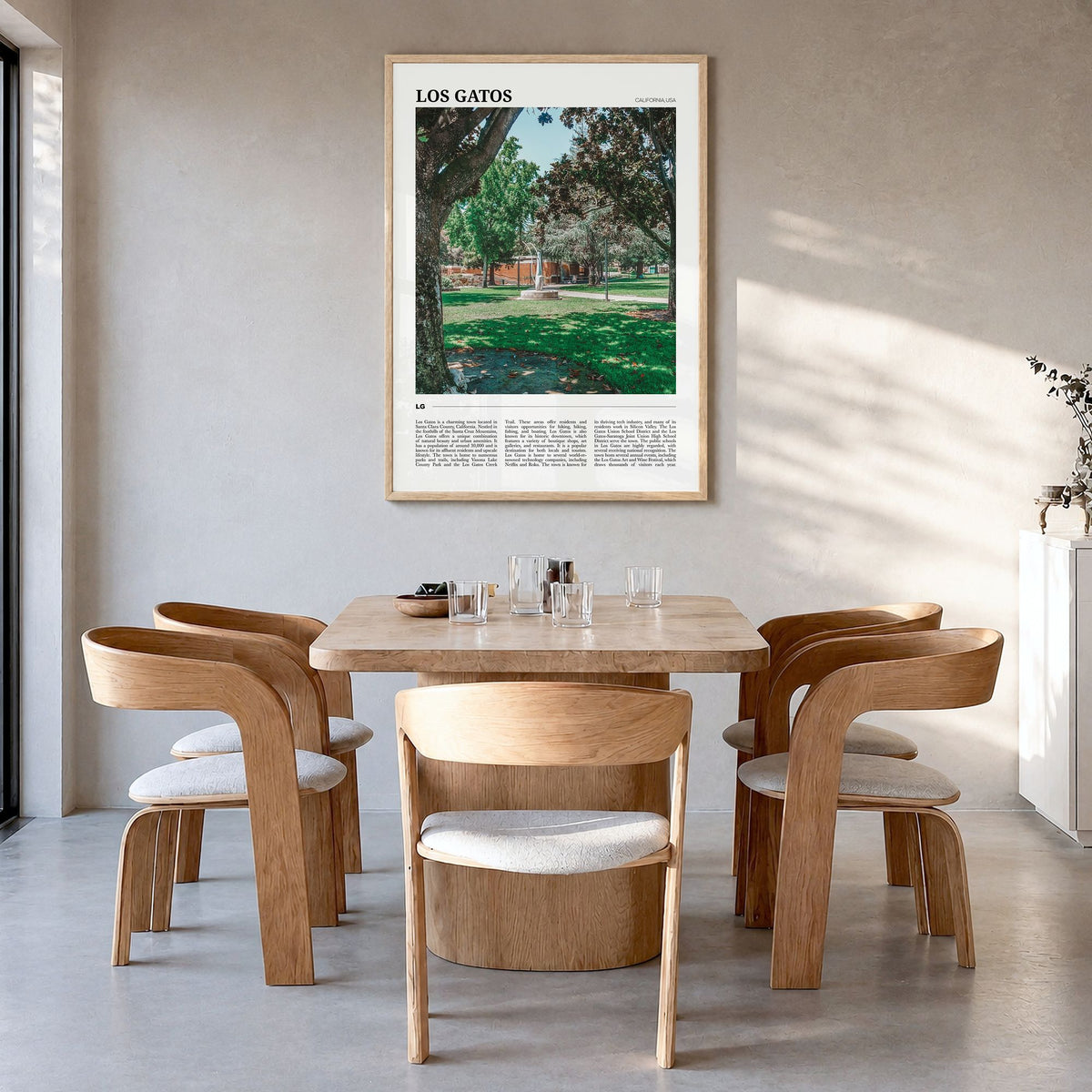 Los Gatos Travel Poster in a natural wood frame, hanging in a dining room