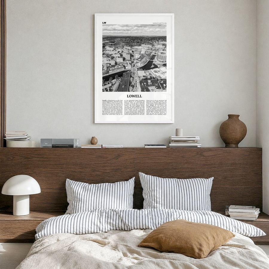 Lowell Newspaper Poster in a white wood frame, hanging in a bedroom