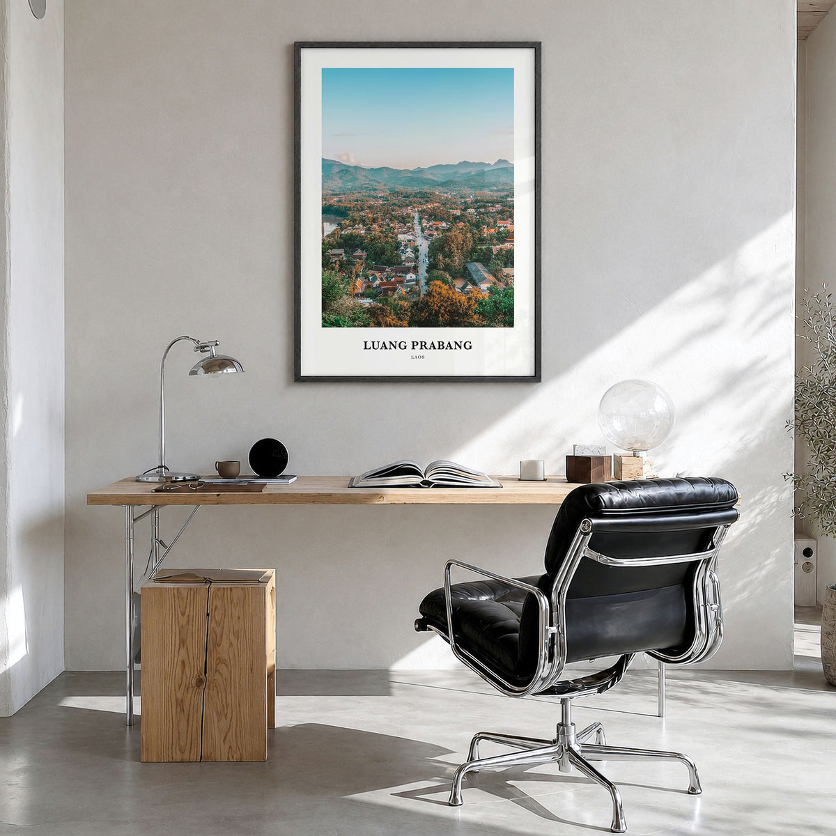 Luang Prabang Classic Poster in a black wood frame, hanging in a bright home office