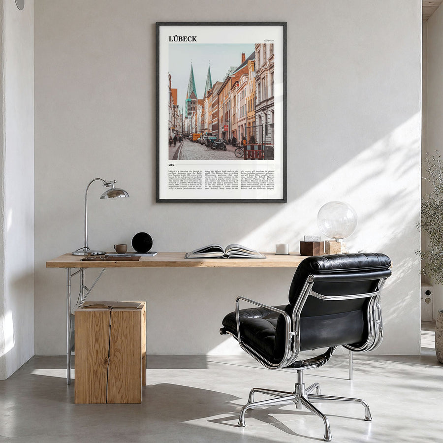Lübeck Travel Poster in a black wood frame, hanging in a bright home office