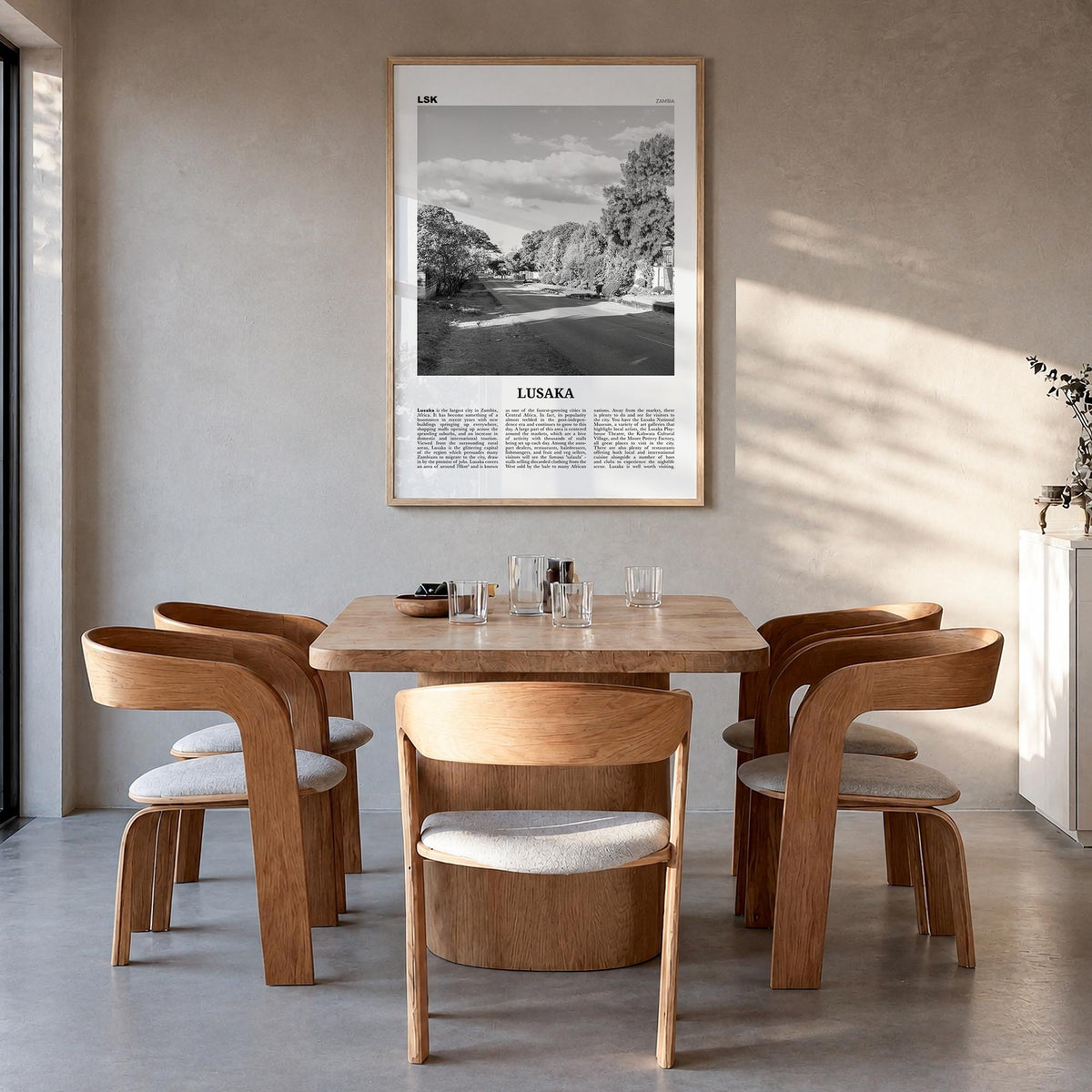 Lusaka black & white newspaper poster of Zambia – vertical wall art in natural wood frame, hanging on wall