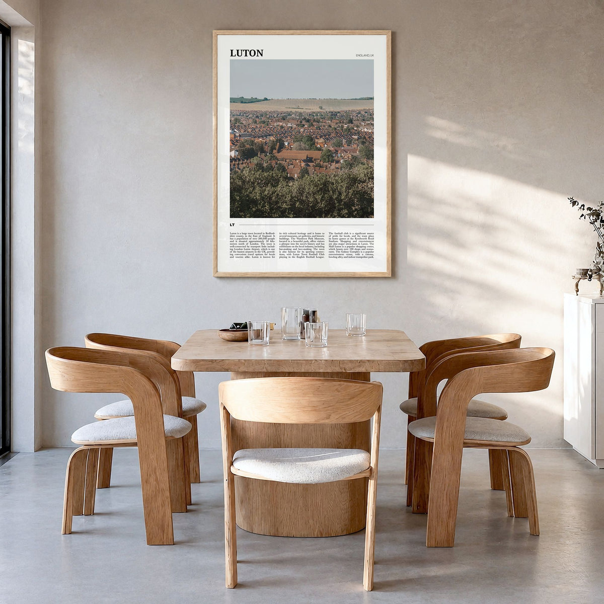 Luton Travel Poster in a natural wood frame, hanging in a dining room