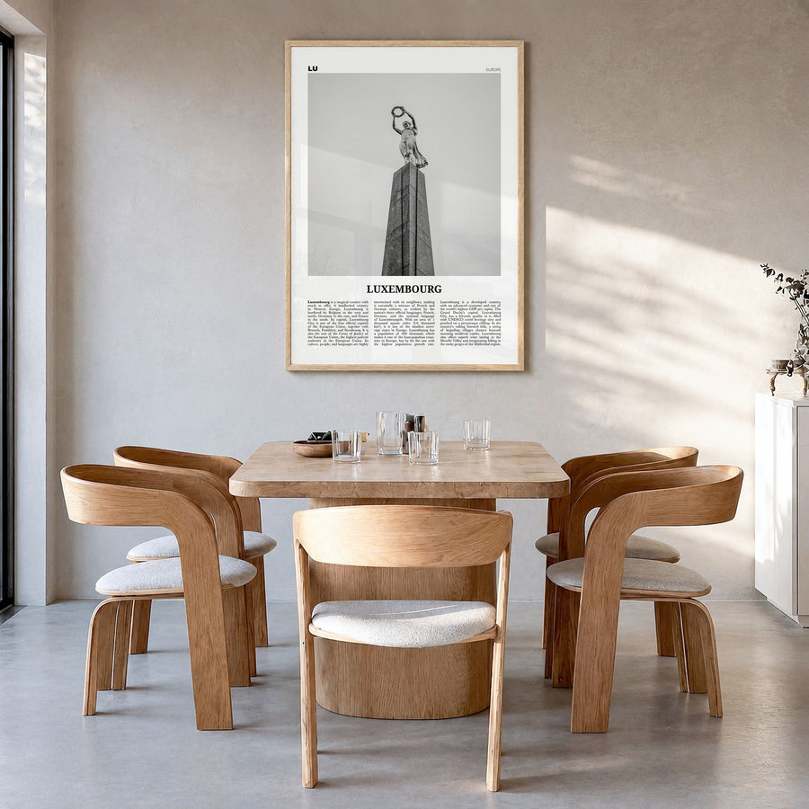 Luxembourg Newspaper No 2 Poster in a natural wood frame, hanging in a dining room