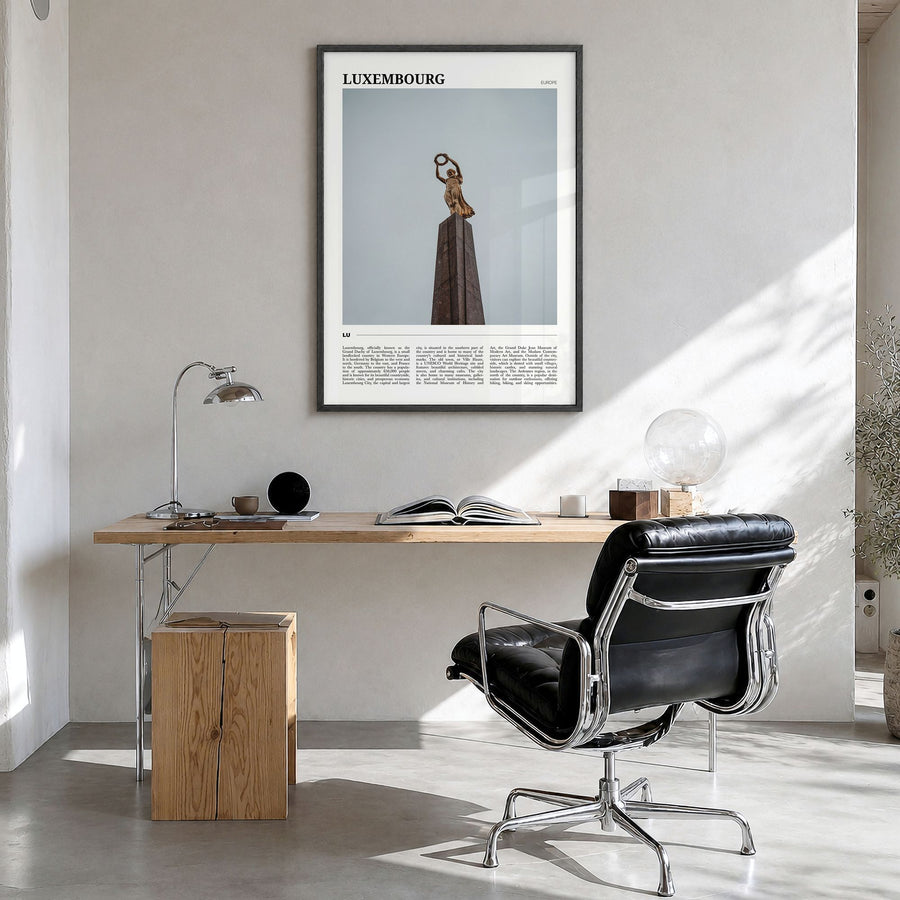 Luxembourg Travel Poster in a black wood frame, hanging in a bright home office