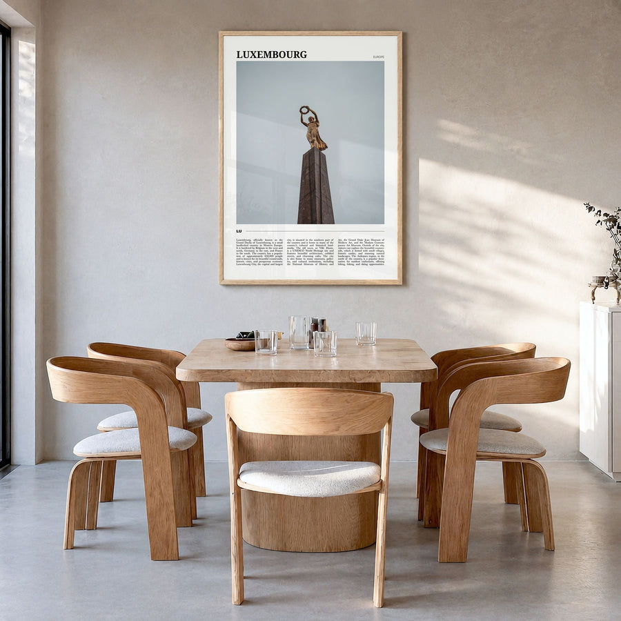 Luxembourg Travel Poster in a natural wood frame, hanging in a dining room