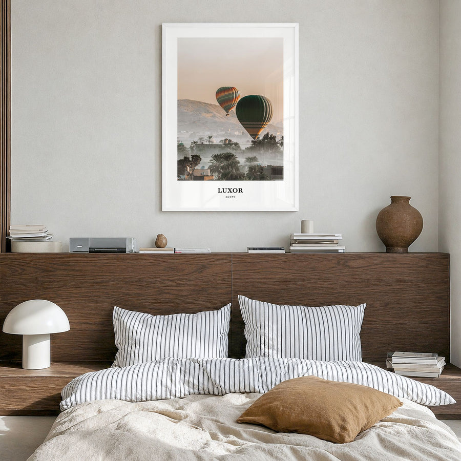 Luxor Classic Poster in a white wood frame, hanging in a bedroom