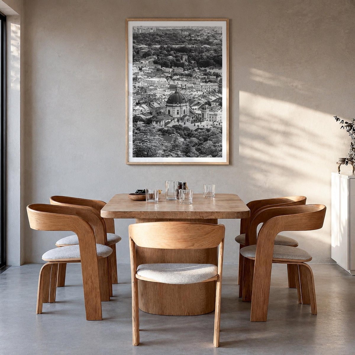 Lviv black & white photo poster of Ukraine – vertical wall art in natural wood frame with white border, hanging on wall